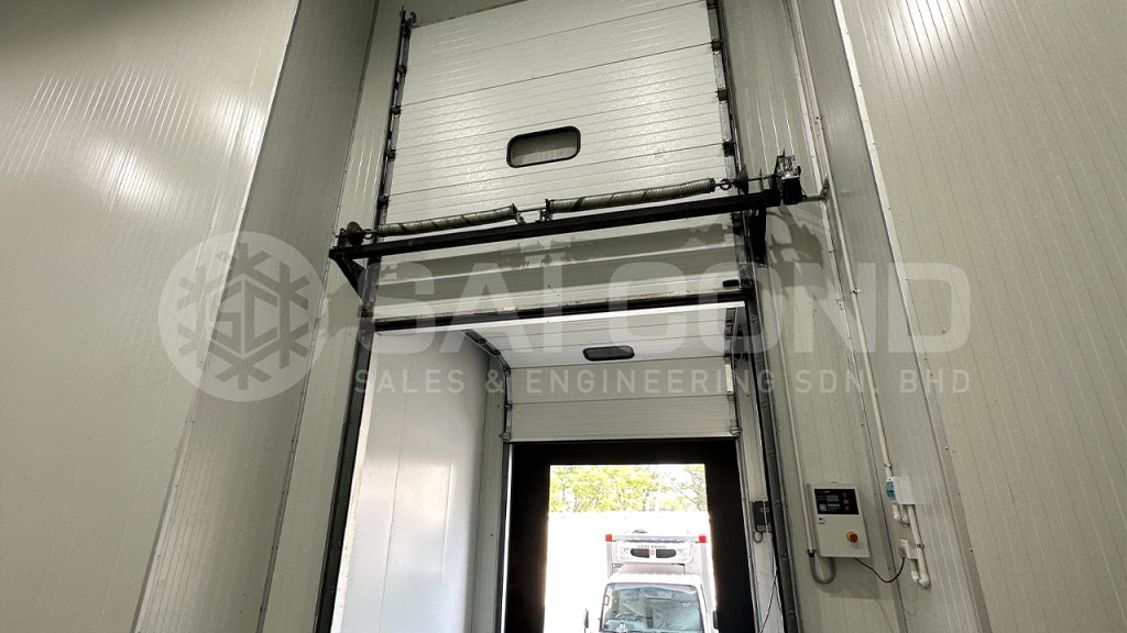 An energy-efficient cold room door with strip curtains and proper sealing to minimize air leaks and reduce refrigeration energy loss.